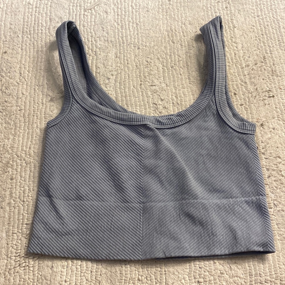 Crop tank top, thick material. Great for lounging/working out. No bra needed